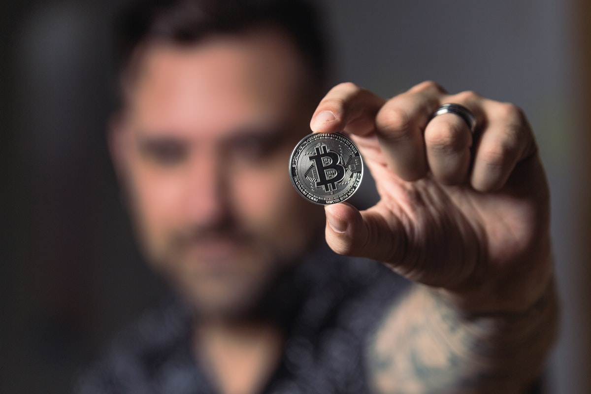 man with crypto coin
